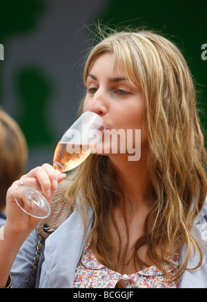 Woman enjoys a glass of champagne at the Wimbledon  Championships 2009 Stock Photo