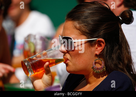 Woman enjoys a glass of Pimms at the Wimbledon  Championships 2009 Stock Photo