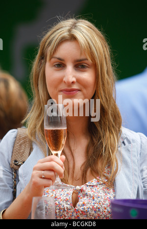 Woman enjoys a glass of champagne at the Wimbledon  Championships 2009 Stock Photo