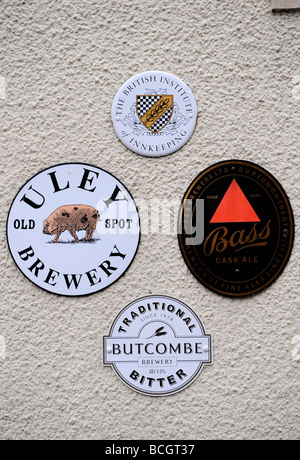 BREWERY SIGNS ON THE OLD SPOT INN A TRADITIONAL PUB IN DURSLEY GLOUCESTERSHIRE ENGLAND UK Stock Photo