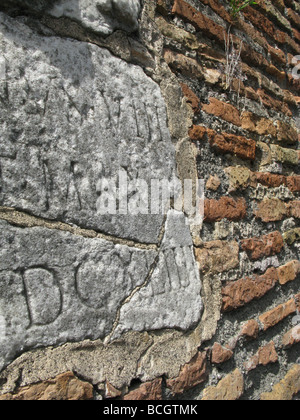old papal carving on street wall in rome, italy Stock Photo