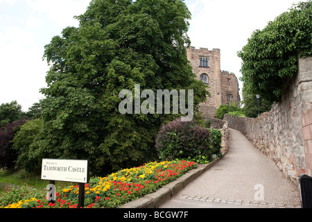 footpath leading up to Tamworth Castle in England with location sign by side of path in flower bed Stock Photo