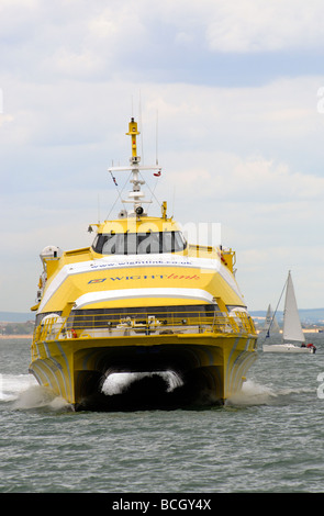 Fastcat Ryde a passenger catamaran of the Wightlink fleet at speed crossing the Solent southern England UK Stock Photo