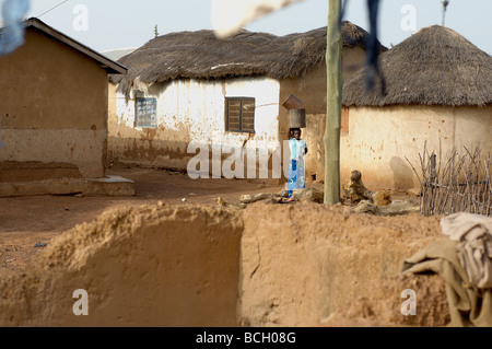 Mud hut homesteads in village in Tamale Ghana Africa Stock Photo