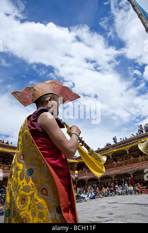 Buddhist monk playing the trumpet. Hemis Gompa festival. Ladakh. India Stock Photo