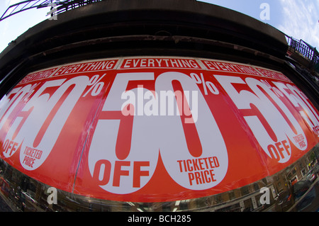 50 percent off signs posted on the windows of a store in Greenwich Village in New York Stock Photo