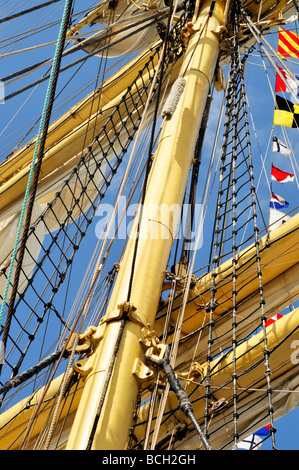Looking up at tall ship mast detail with rope ladders and rigging Stock Photo