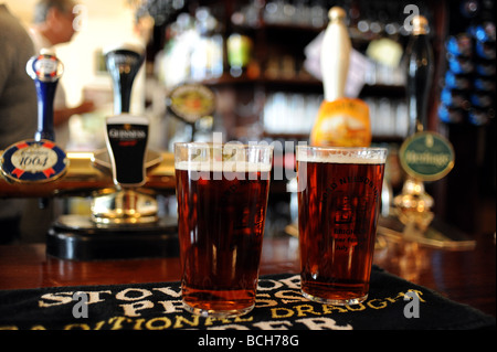 Pints of Harveys beer on the bar at The Lord Nelson Inn in Trafalgar Street Brighton Sussex UK Stock Photo