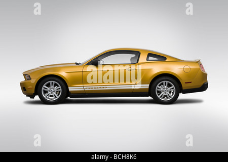 2010 Ford Mustang V6 in Gold - Drivers Side Profile Stock Photo