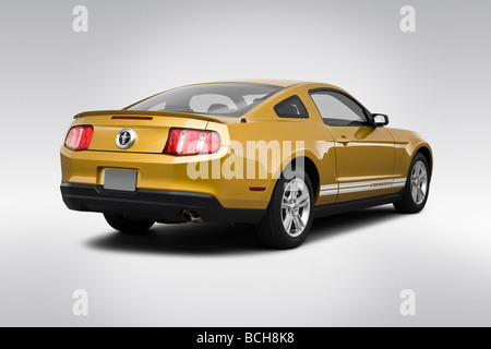 2010 Ford Mustang V6 in Gold - Rear angle view Stock Photo