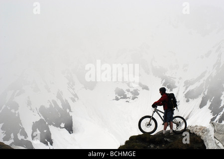 Male Bicyclist @ Top of Mt Marathon Kenai Mtns KP AK Summer Extreme Mtn Biking Stock Photo