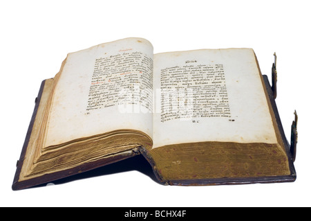 Old big book with hard cover is opened. Isolated over white. Stock Photo