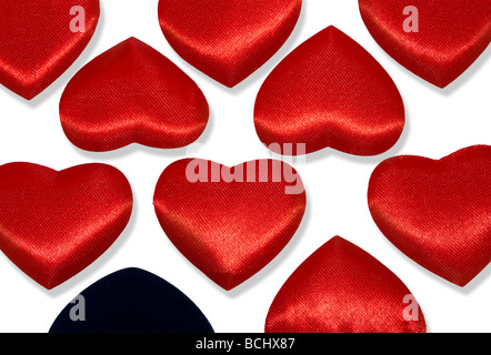 Rows of Red hearts and one black heart. Isolated over white with shadows. Background. with clipping path without shadows Stock Photo