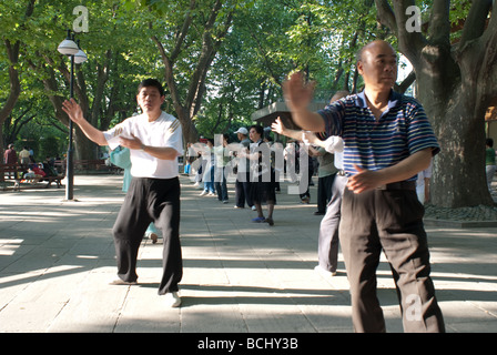 Group of people taking part in Tai Chi exercise at Fuxing Park Shanghai CHina Stock Photo