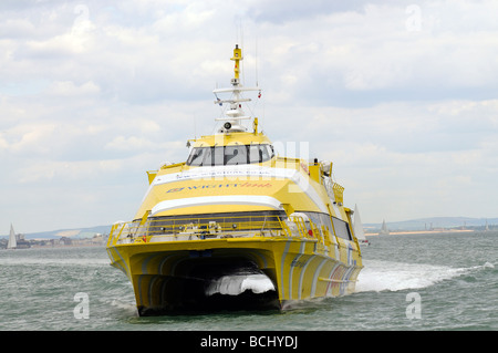 Fastcat Ryde a passenger catamaran of the Wightlink fleet at speed crossing the Solent southern England UK Stock Photo