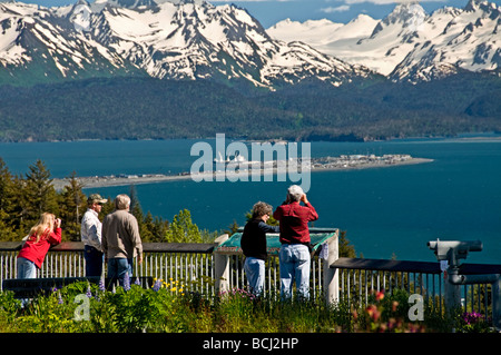 Tourists take pictures of the view of the Homer Spit, Kachemak Bay from the Baycrest Overlook on the Sterling Highway, Alaska Stock Photo