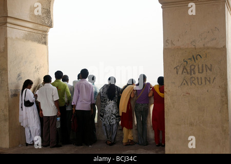 Indian tourists observe the view from the Golconda Fort in Hyderabad in India. Stock Photo