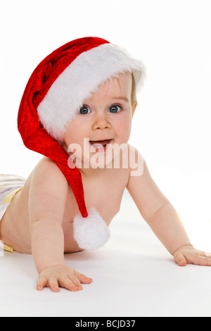 Small child with Santa Claus hat baby isolated on white background Stock Photo