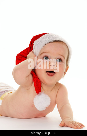 Small child with Santa Claus hat baby isolated on white background Stock Photo