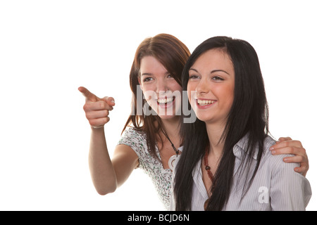 Two young girls see something very funny and laugh Stock Photo