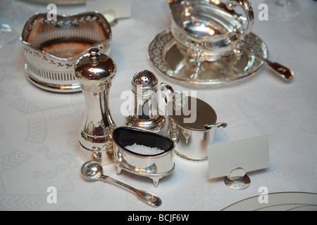 Formal table setting with silver condiments Stock Photo