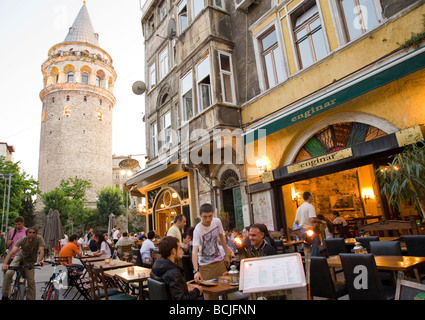People at a restaurant in Istanbul next to the Galata Tower in Istanbul Stock Photo