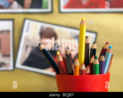 colored pencils in school pots Stock Photo