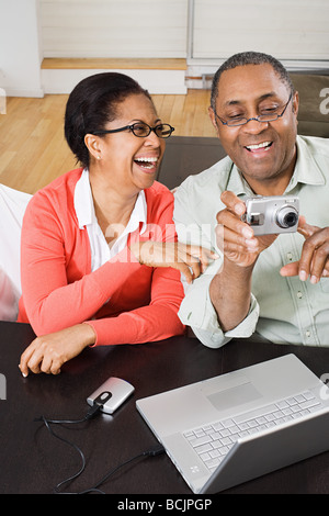 Mature couple with digital camera Stock Photo