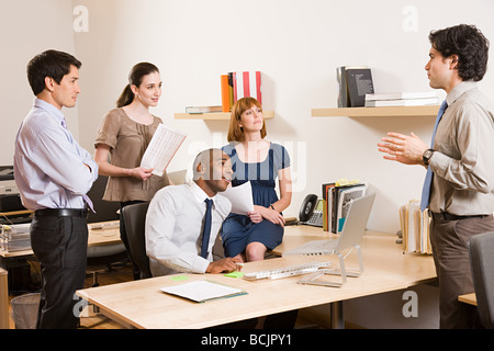 Five office workers in a meeting Stock Photo