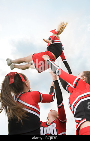 Cheerleaders with arms raised Stock Photo, Royalty Free Image: 14577027 ...