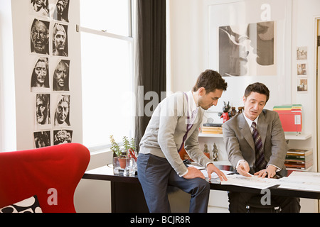 Fashion designers having discussion Stock Photo
