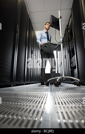 Computer technician working on a server Stock Photo