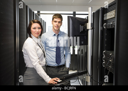 Two computer technicians working on a server Stock Photo