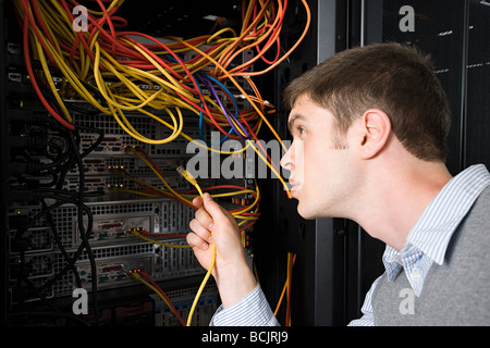 Computer technician working on a server Stock Photo