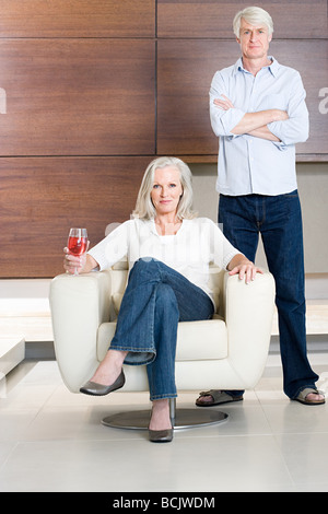 Middle aged couple with glass of wine Stock Photo