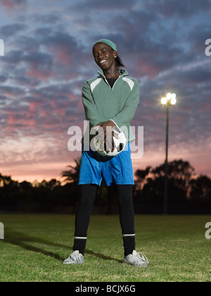 Teenage african boy with football Stock Photo