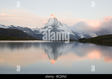 Matterhorn reflected in lake at sunset Stock Photo