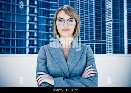 Young pretty businesswoman staring into camera Stock Photo