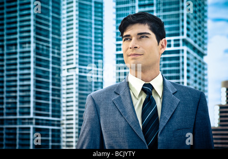 Confident Latin businessman with architectural backdrop Stock Photo