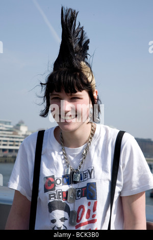 A punk girl 'Rae Ray Riots' with a large Mohican, London Bridge, London, UK 15.3.2009 Stock Photo