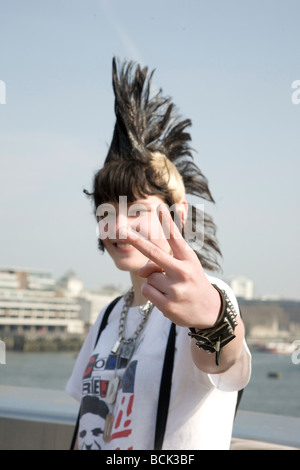 A punk girl 'Rae Ray Riots' with a large Mohican, London Bridge, London, UK 15.3.2009