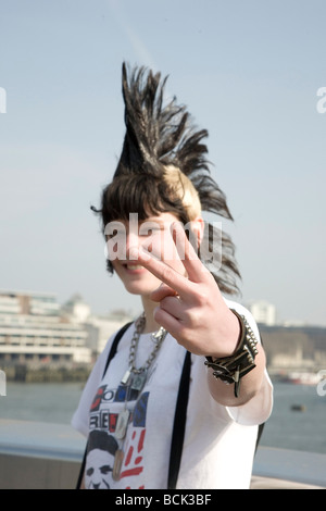 A punk girl 'Rae Ray Riots' with a large Mohican, London Bridge, London, UK 15.3.2009 Stock Photo