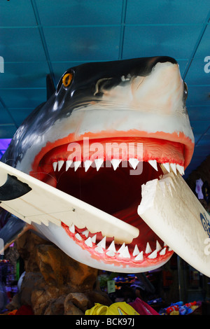 Model of shark with surf board in mouth in airport duty free shop in Spain Stock Photo