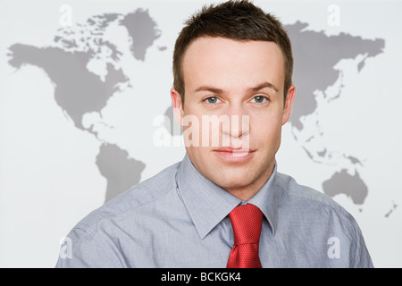Office worker and world map Stock Photo