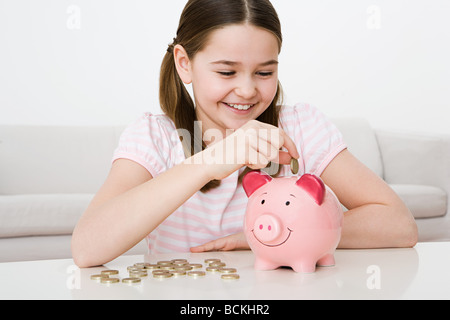 Young girl with piggy bank Stock Photo