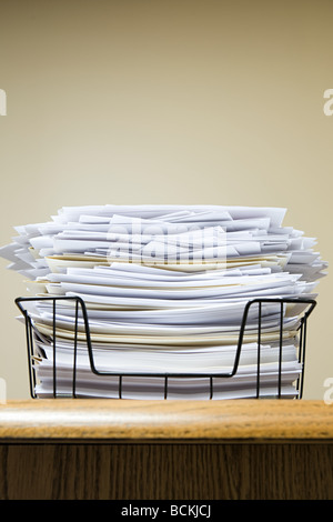 Overflowing paper inbox Stock Photo