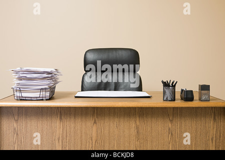 Office desk with overflowing inbox Stock Photo