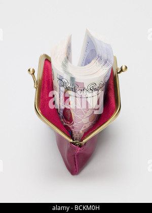 Twenty pound notes in a purse Stock Photo