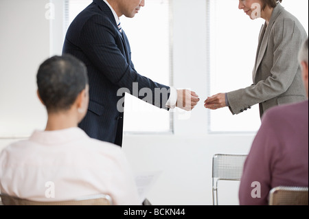 Businesspeople exchanging business cards Stock Photo
