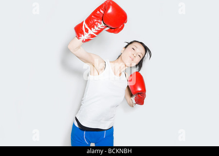Young woman in boxing gloves Stock Photo